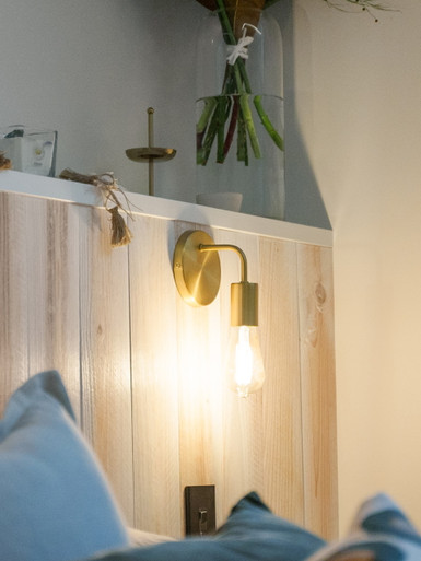 Brushed brass wall light