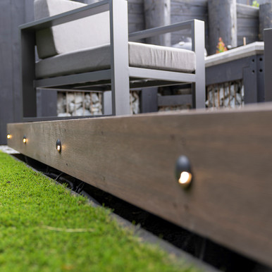 Textured black one-way inground deck light