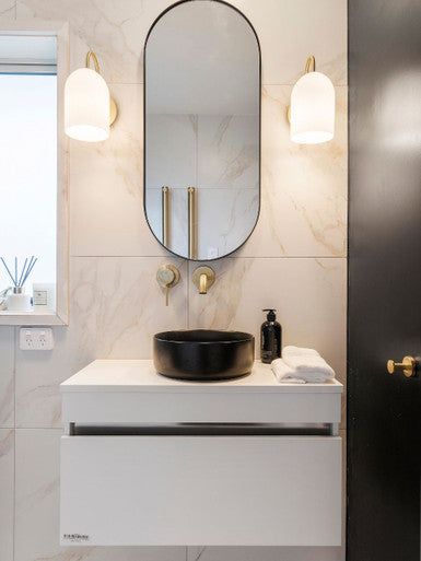Brass wall light with opal ribbed glass