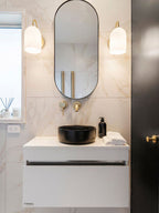 Brass wall light with opal ribbed glass